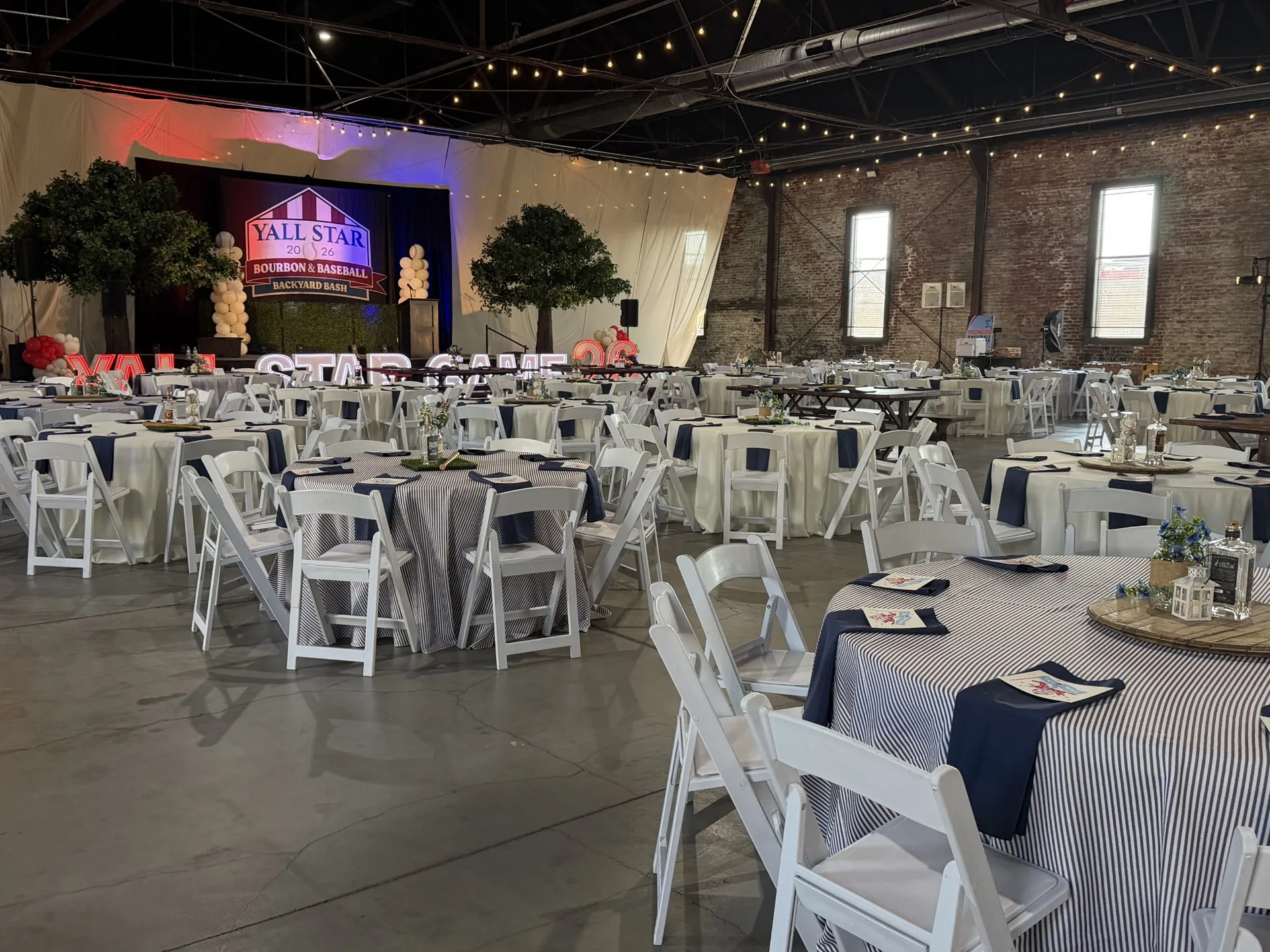 Themed corporate dinner with striped linens and navy napkins