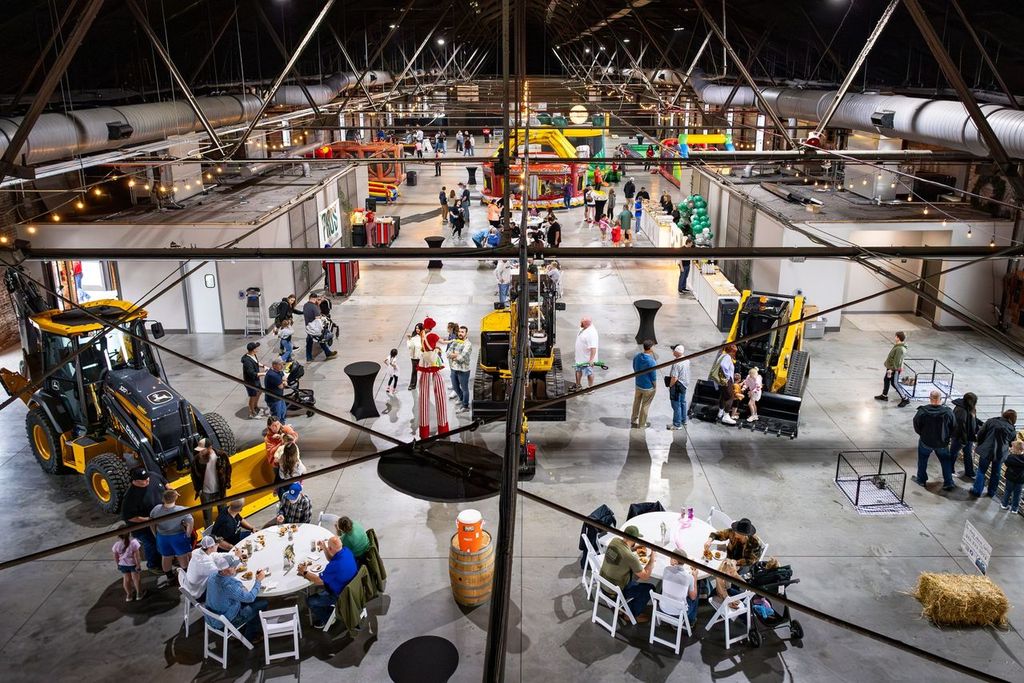 Family expo filling the hall with inflatables, exhibits and seating