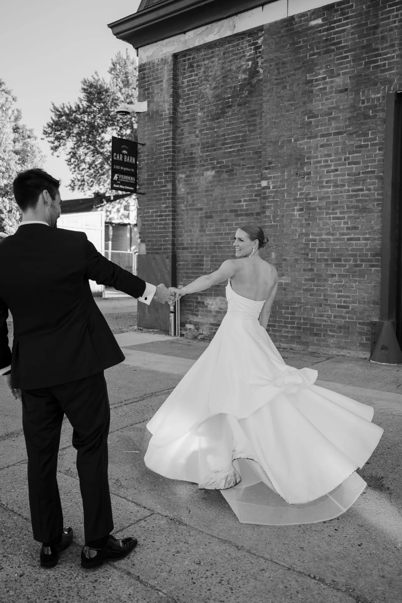 Bride twirling outside the Car Barn entrance