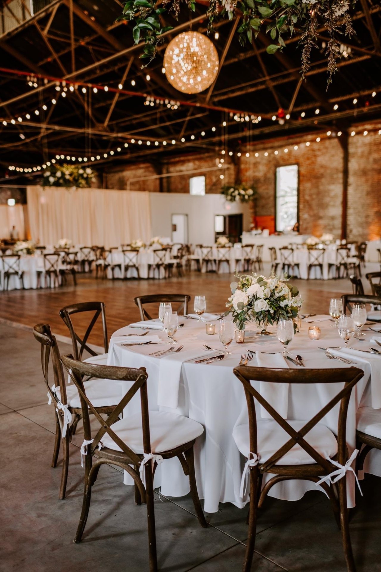Reception with hanging greenery and dance floor