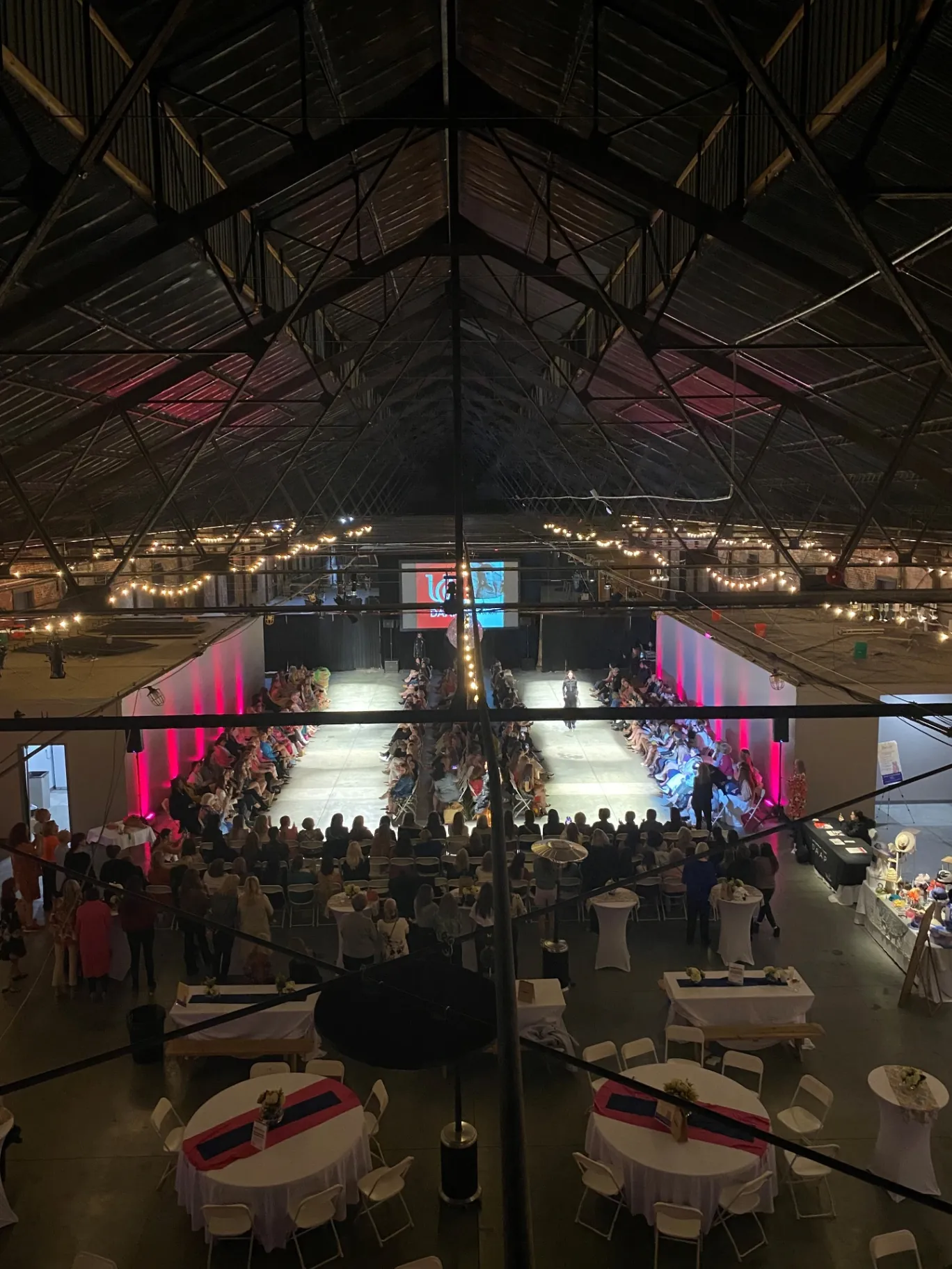 Fashion show runway from above showing the trussed roof
