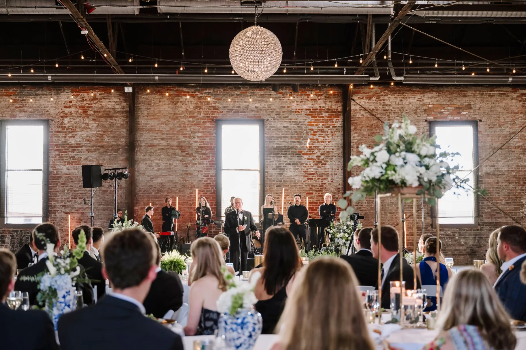 Live band performing during wedding reception toast